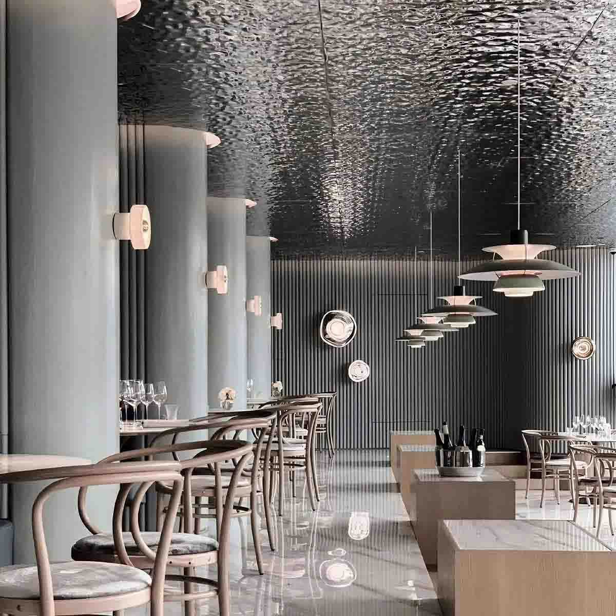 Stainless steel interior design featuring modern metal finishes and decorative architectural details